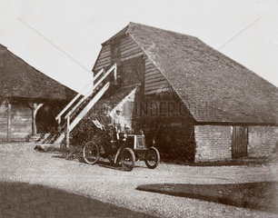 C S Rolls' 6 hp Renault motor car parked outside a farm building  c 1902.