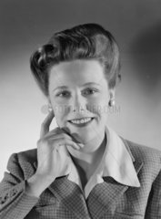 Smiling woman  c 1950.