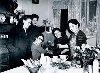 Landlady welcoming her guests at teatime  29 October 1945.