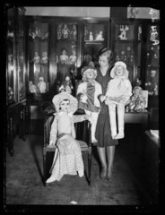 Woman with three rag dolls  1932.
