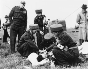 Royal Air Force para-nurses attending an air crash victim  7 October 1948.