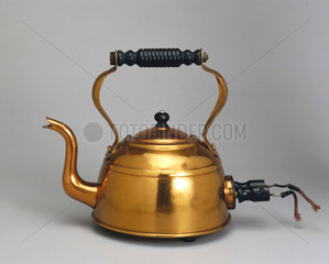 Electric copper kettle  with immersed element  c 1921.