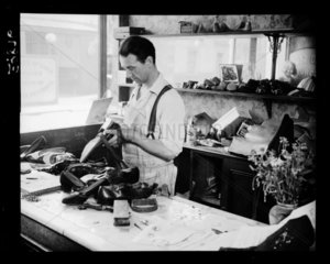 Cobbler at work  c 1935.