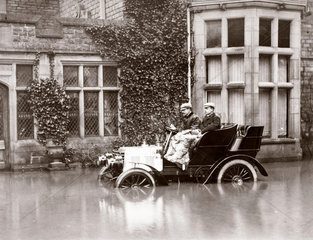 C S Rolls and Colonel M Mayhew in a Napier motor car in flood water  1900.
