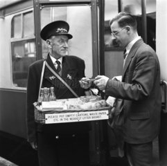 Refreshment seller at King's Cross station  London  18 December 1953.