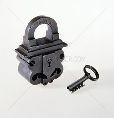 Heavy  black wrought-iron padlock with hollow 4-ward key  1600-1800.