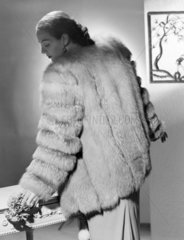 Woman wearing fur coat  c 1950.