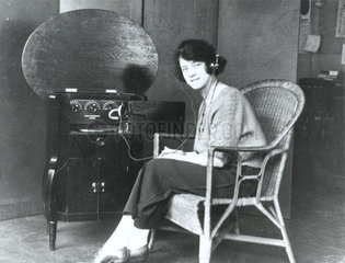 Woman listening to the wireless  c. 1920.