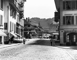 View along a cobblestone street of a Swiss