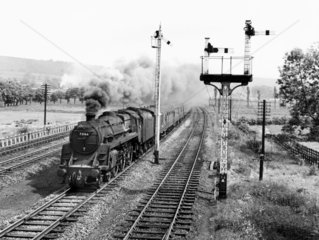 Steam locomotive with the northbound 'Waverley Express'  near Keighley  1962.