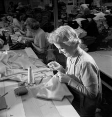 Middle aged woman hand sewing  Lyle and Scott Ltd  1951.