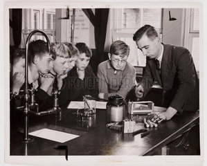 School children watching an experiment in the science laboratory  1938.