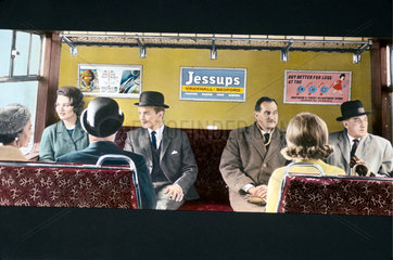 Commuters sitting in a British Rail rail coach  1965.