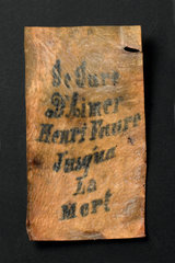Tattooed human skin with inscription  French  1850-1920.