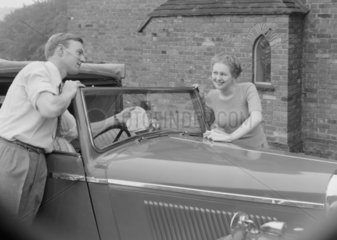 Couple washing a car  1949.