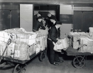 Loading sunday newspapers on the Belfast boat train  Euston Station 1937.