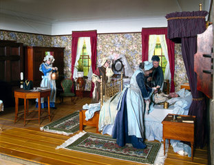 Diorama in the Science Museum illustrating childbirth in the 1860s.