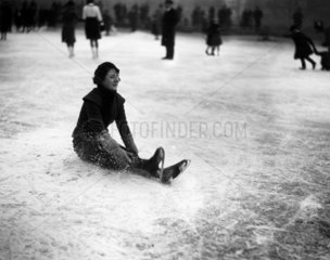 Woman ice skater falling over at Wimbledon  London  27 January 1932.