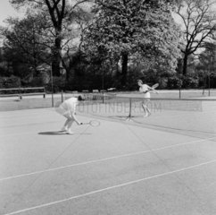 A couple 'playing tennis'  1955.