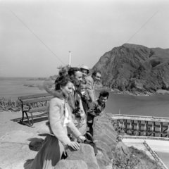 Men  women and children on a Promenade in Ilfracombe  Devon  1953.