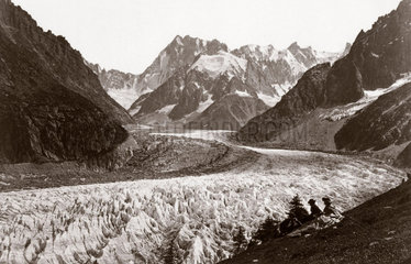 Walkers resting beside a glacier  French Alps  c 1870s.