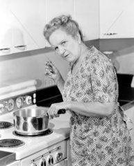 Woman cooking  1950.