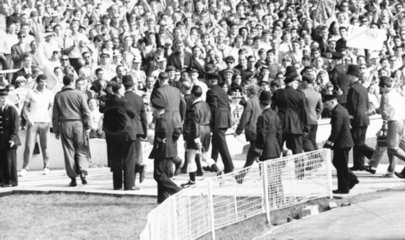 Referee being escorted from the pitch  World Cup  Wembley  July 1966.