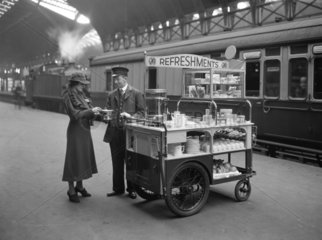 Passenger at a refreshment trolley  Paddington Station  1937.