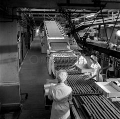 Women on biscuit bakery production line  1957.