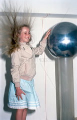 Girl holding a Van de Graaf generator  1998.