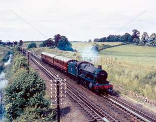 Steam locomotive 'Honington Hall' passing o