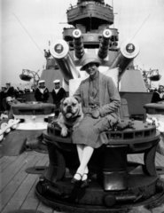Navy wife and pet dog aboard HMS 'Revenge'  c 1927.