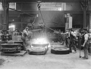 Workers casting steel in the forge at Horwich works  Bolton  1919.