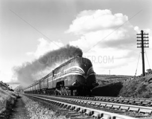 Steam locomotive 'Coronation' with train  Shap Summit  Cumbria  1937.