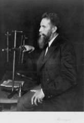 Wilhelm Conrad Roentgen  German physicist  at his workbench  1906.