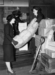 Women porters loading parcels on to a train  27 February 1941.