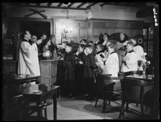 A choir rehearsing Christmas carols  Crispin Inn  Windsor Forrest  1935.