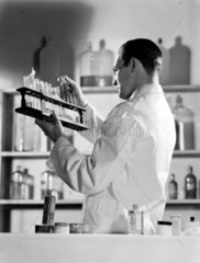 Chemist working in a laboratory  1949.