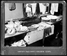 Dirty plates in the kitchen  1947-1955.