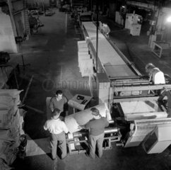 Men inspect fibre glass sheets as they come off number 9 machine  1964.