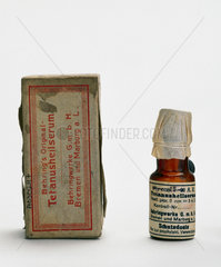Bottle of Behring’s original tetanus serum and packet  c 1915.