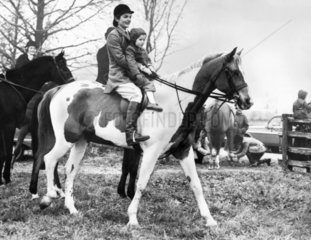Jackie and Caroline Kennedy riding a horse  March 1963.