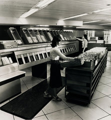 The Barclays London Clearing House: female operators with sorting machine