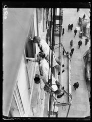 Painters working in a cradle  Whitehall  London  1932.