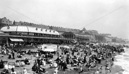 Crowded beach in summer  c 1910s.