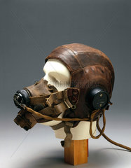 Leather flying helmet and mask  c 1946.
