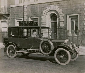6 cylinder Cunard saloon with chauffeur  and luggage on roof rack