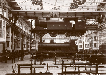 Crane lifting a locomotive  Darlington Works  Durham  c 1902.
