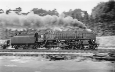Panning shot of a 9F 2-10-0 locomotive  No 92204  September 1964.