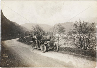 Motor car beside a lake  Wales  c 1912.